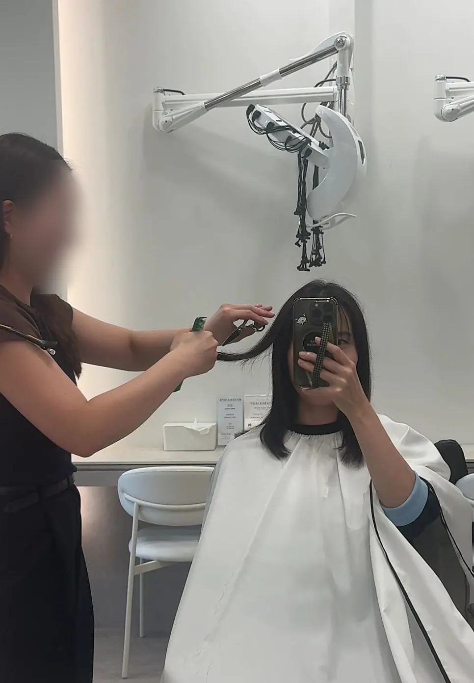 Hair lightly blow-dried after the first length trim