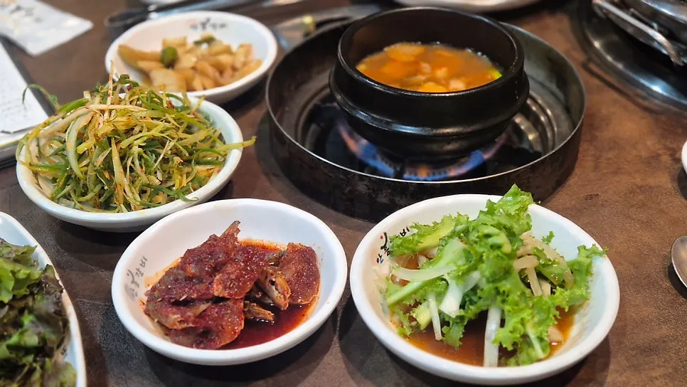 Bossam kimchi and seasoned scallion salad side dishes