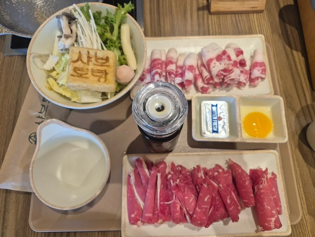 Basic shabu broth and meat ingredients at Shabu Torang