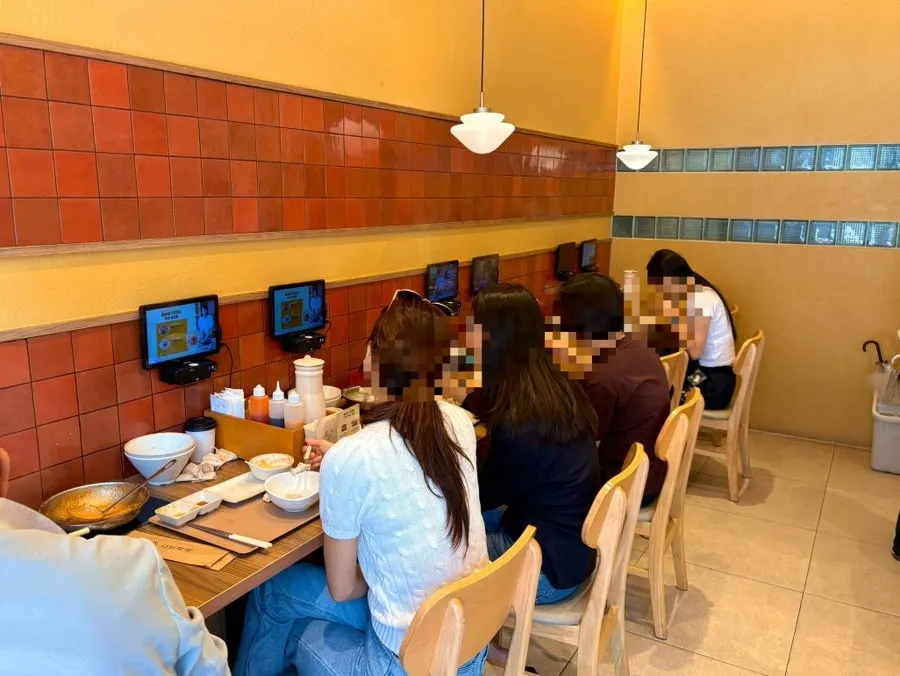 Table with individual induction stove at Shabu Torang