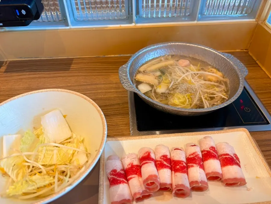 Adding ingredients into the basic broth pot