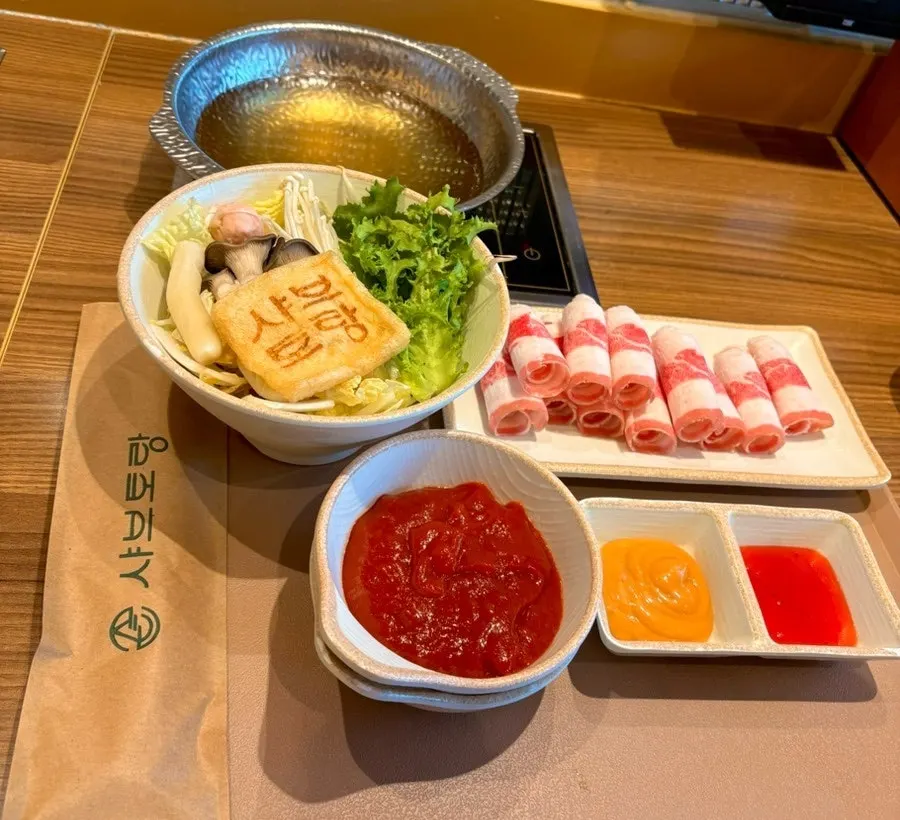 Pot of tomato broth shabu-shabu