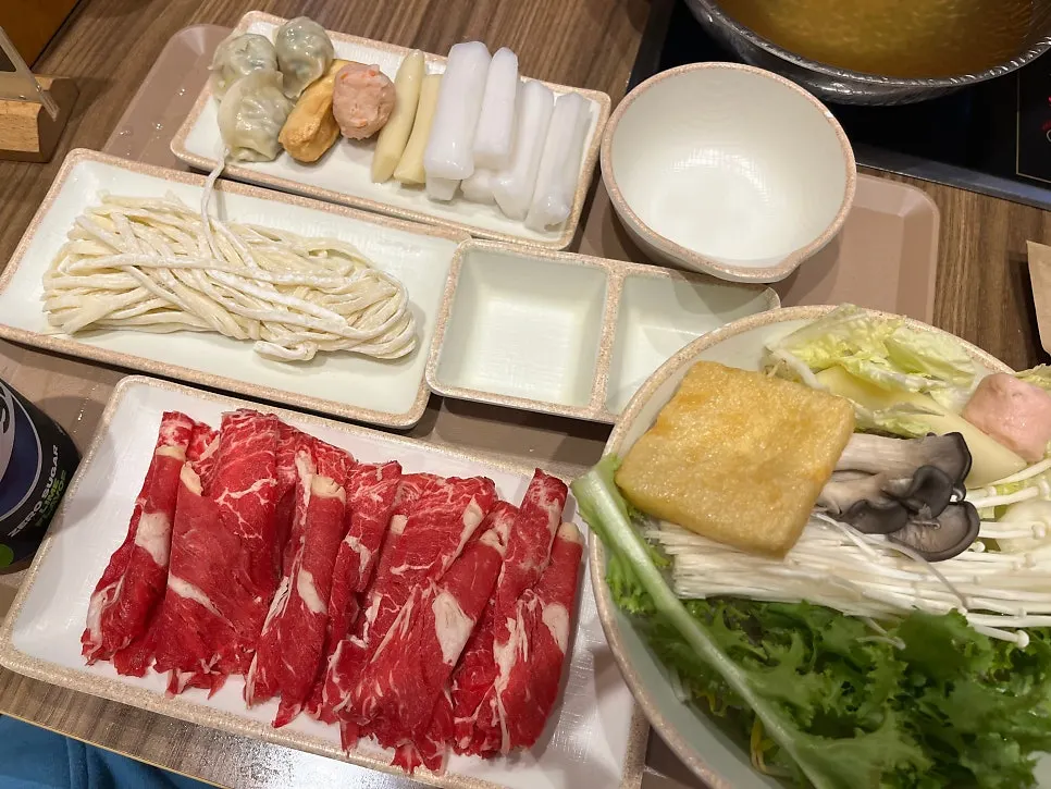 Individual shabu pot filled with basic broth