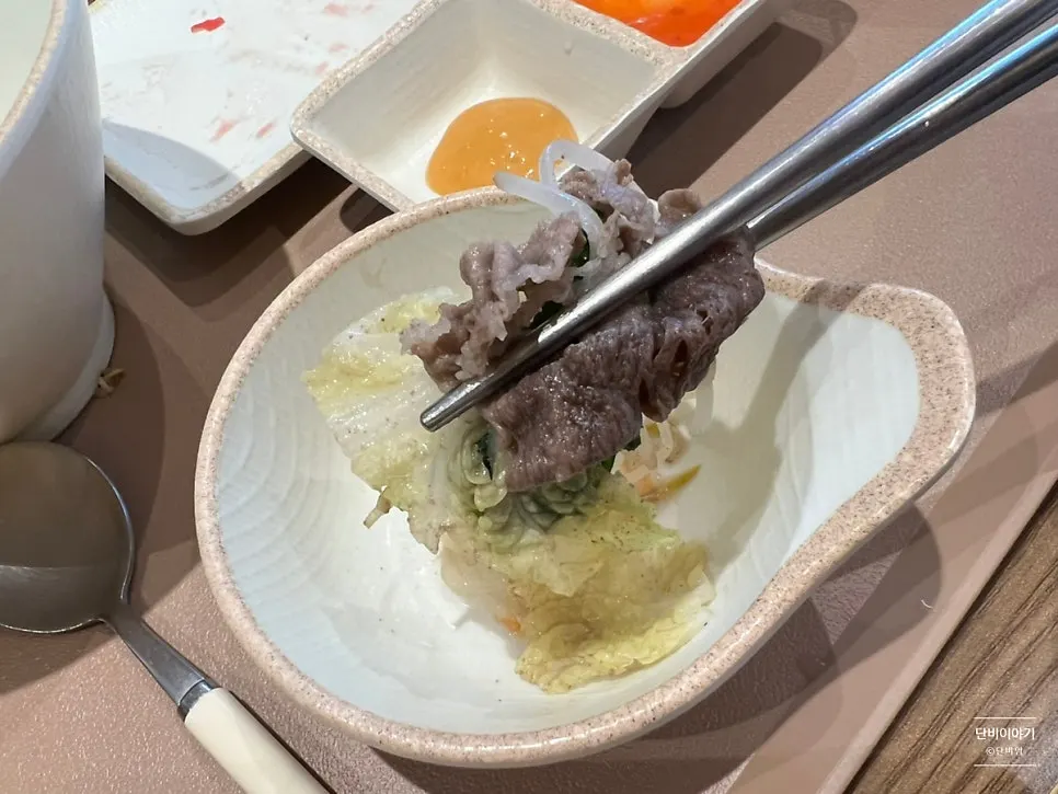 Cooked shabu-shabu meat ready to be scooped out