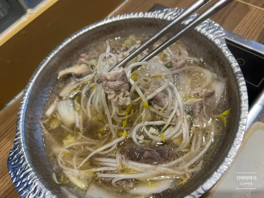 Finishing the shabu-shabu meal by drinking the broth