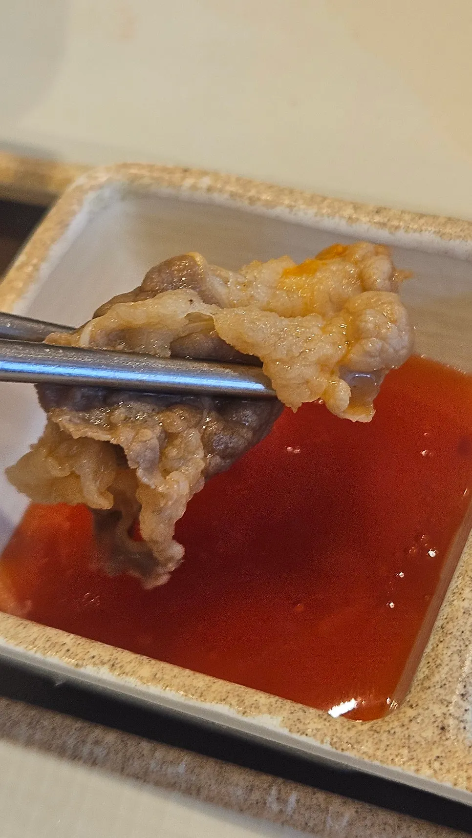 Shabu-shabu table setting with three sauces