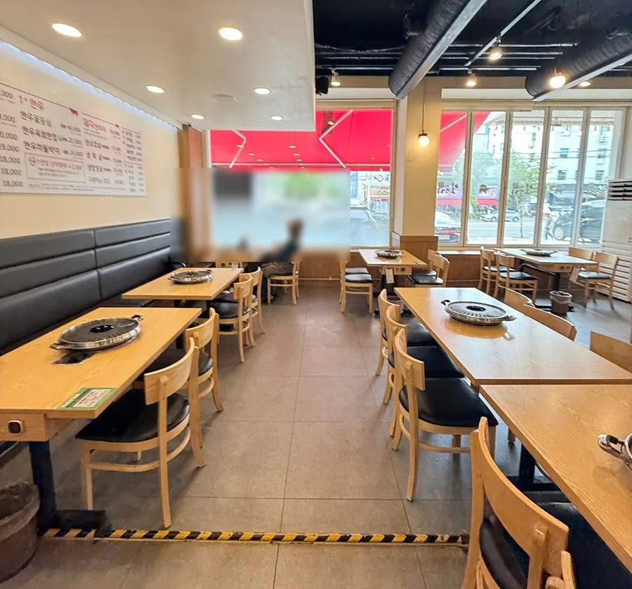 Meat restaurant hall with wide tables