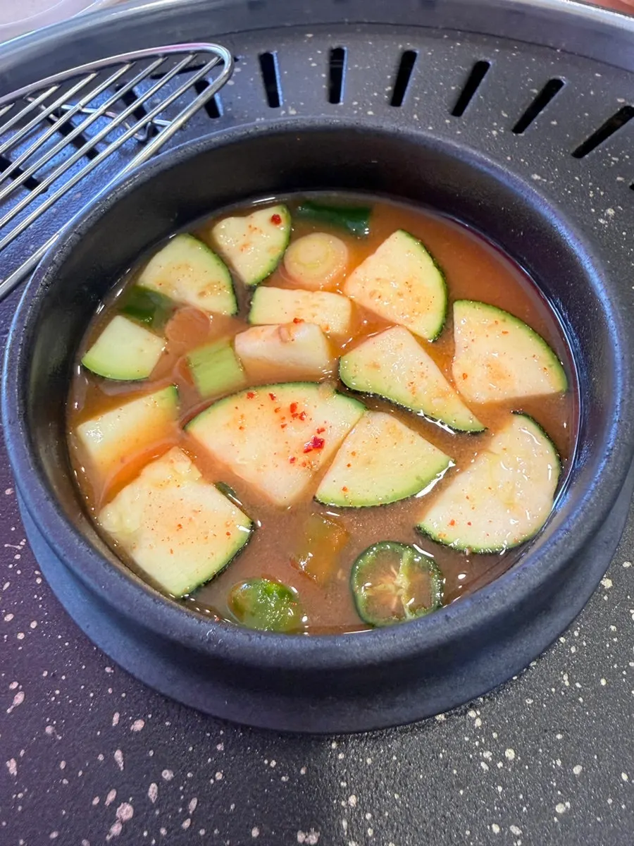 Basic side dishes including kimchi, pickled chili peppers, and pickled onions