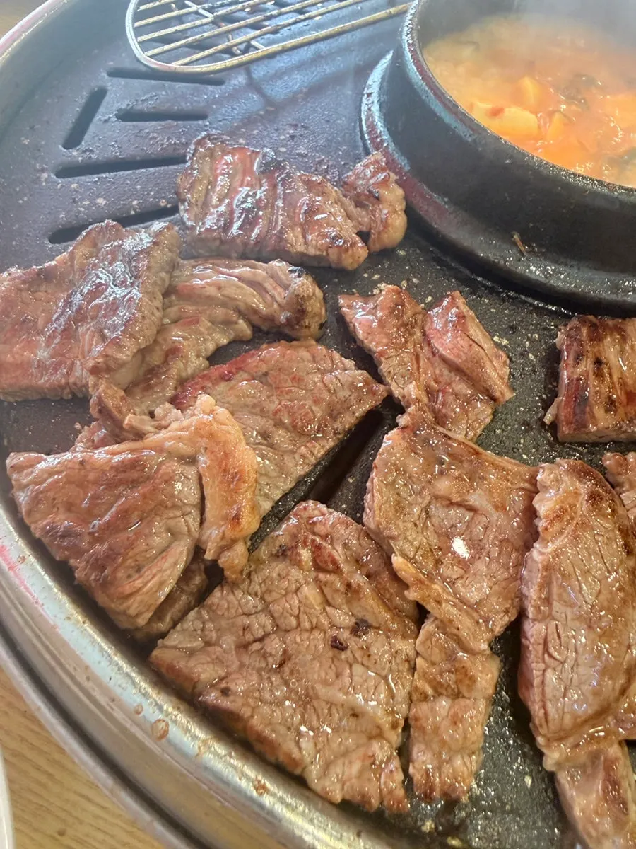 A grilled piece of beef dipped in salt