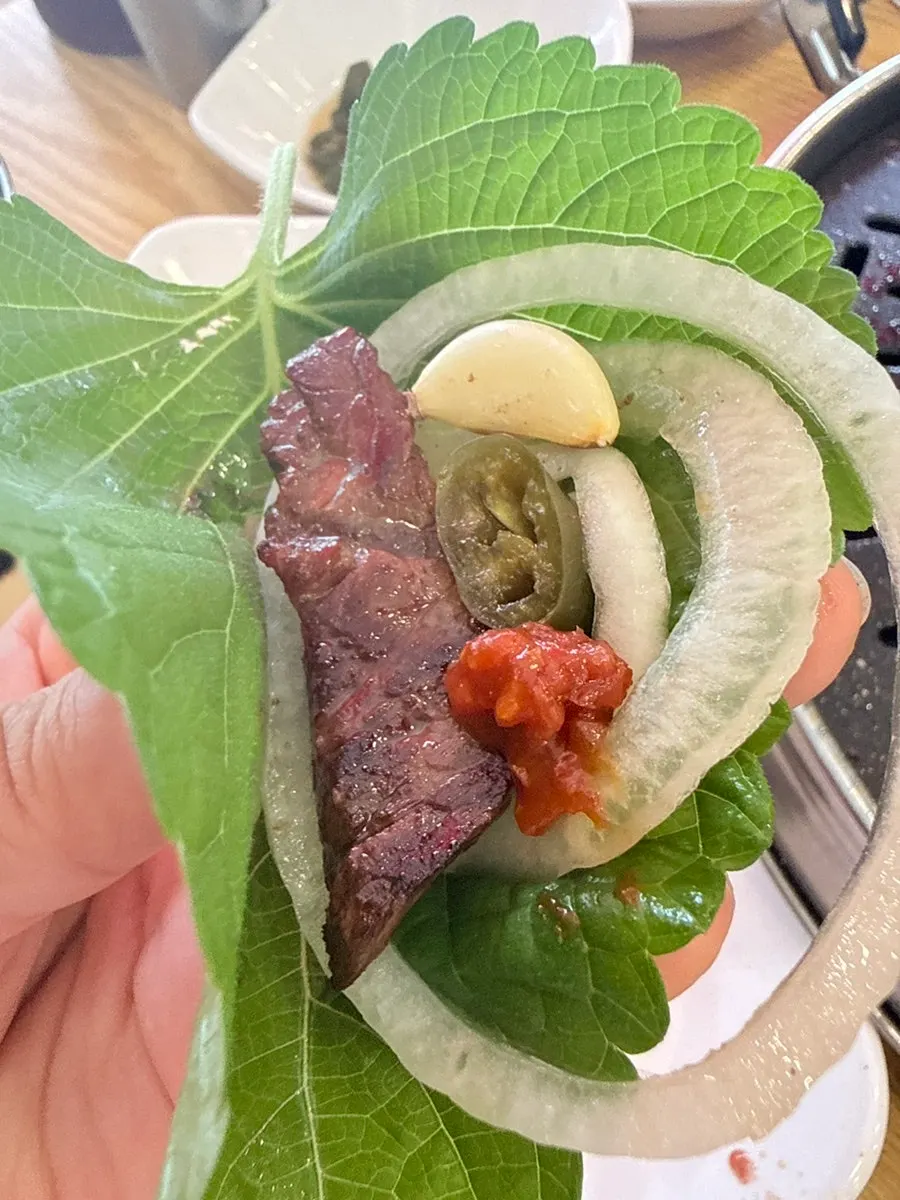 Lettuce wrap with beef and pickled onions