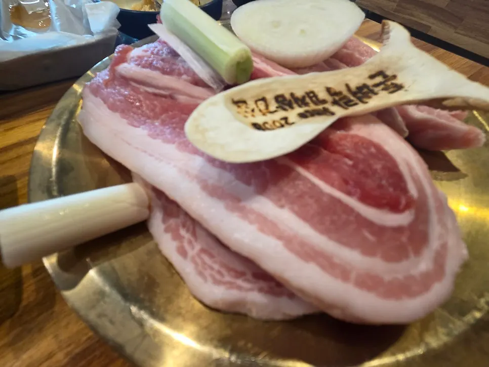 Korean pork samgyeopsal and kimchi grilling