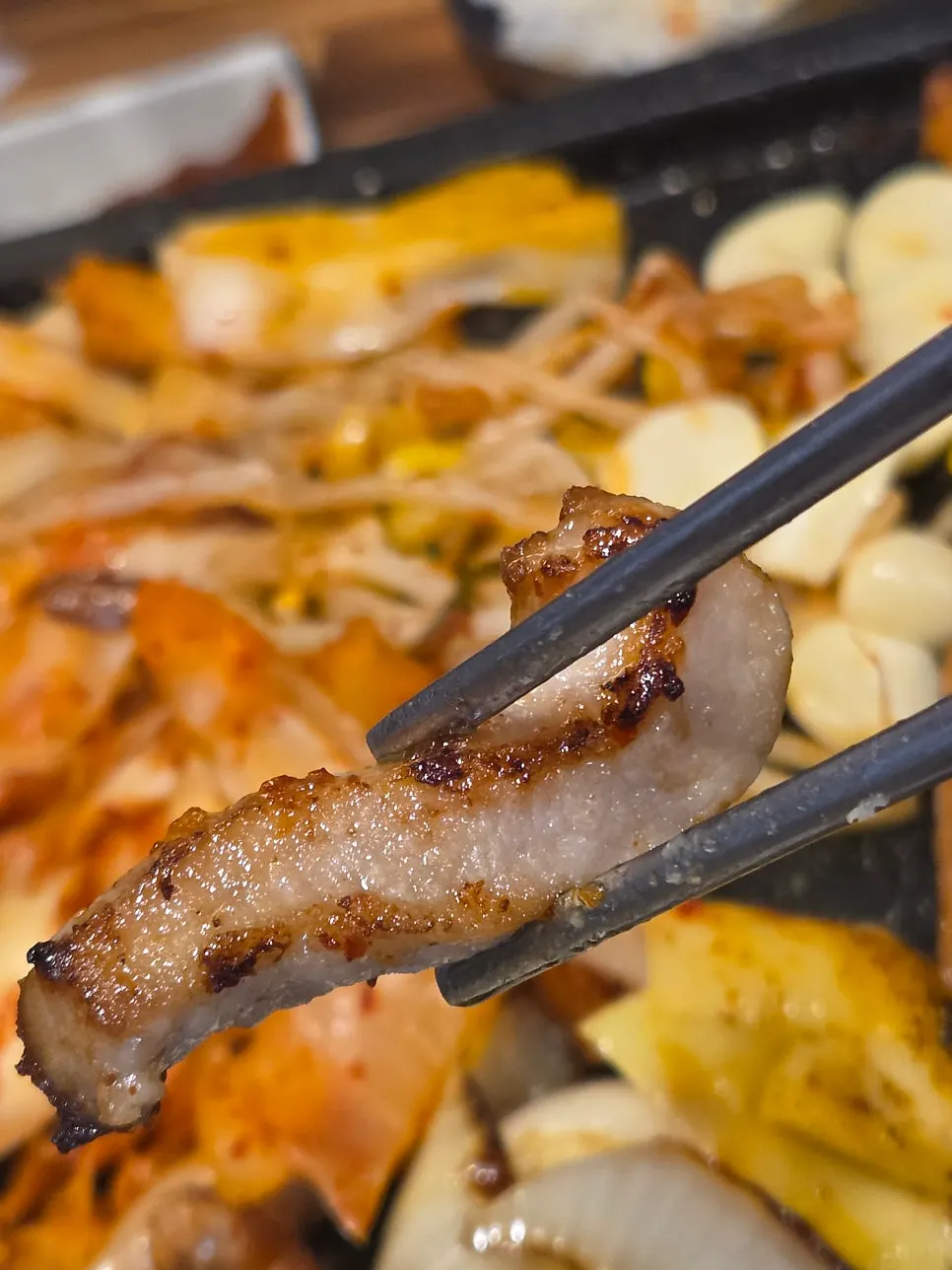 A chewy piece of grilled pork neck
