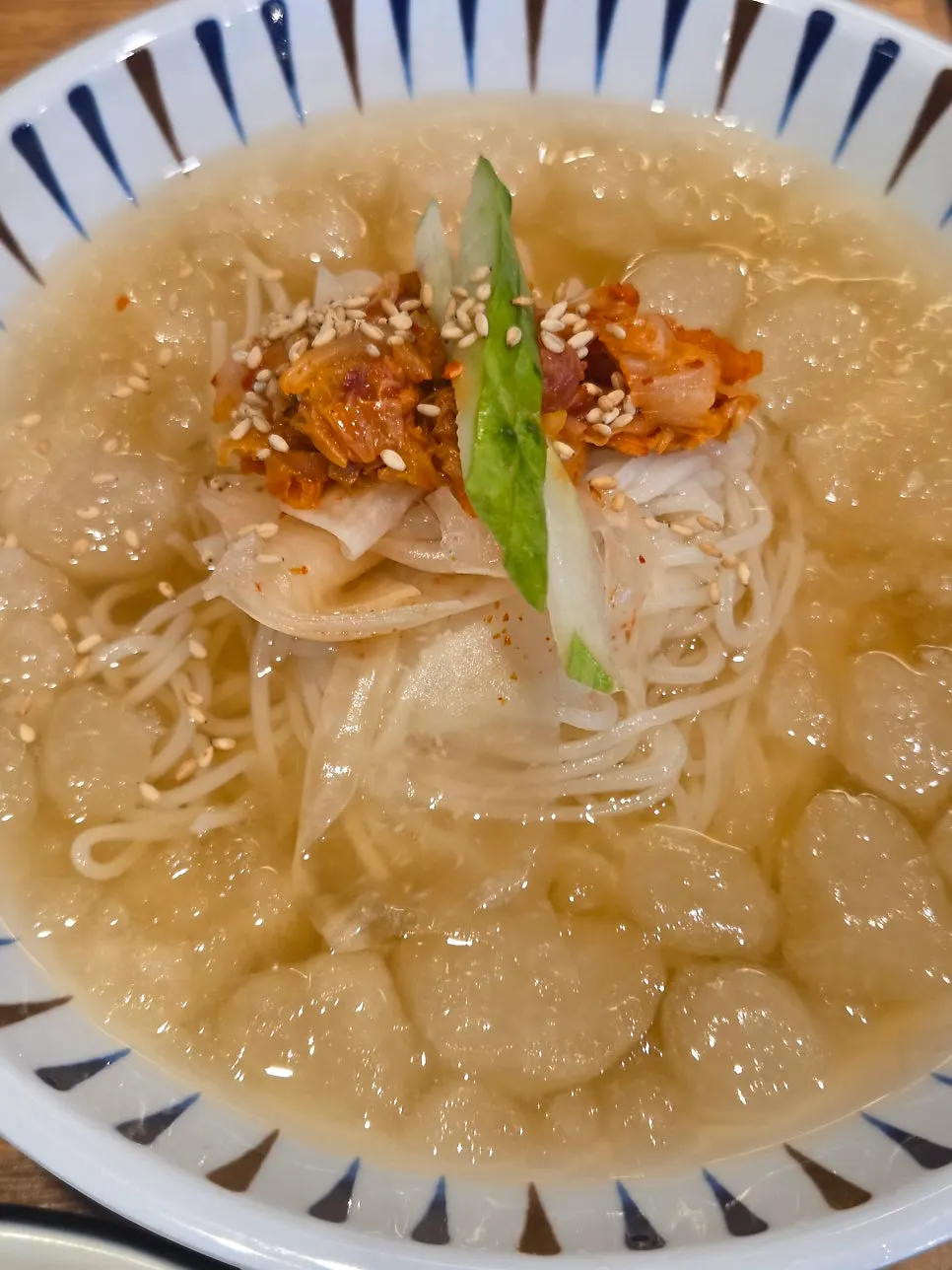 Cold somyeon noodles in slushy broth for dessert