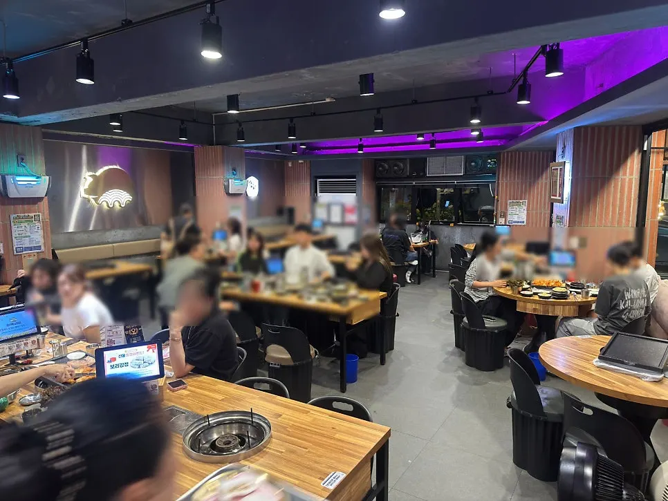 Interior of the restaurant with tables for four