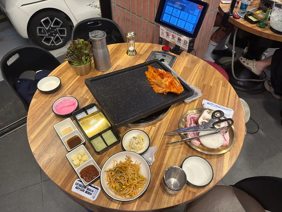 Basic table setting with sauce, pickled radish, macaroni, and bean sprouts