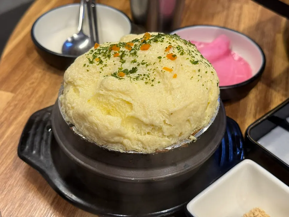 Bomb-style steamed egg puffed up and nearly overflowing