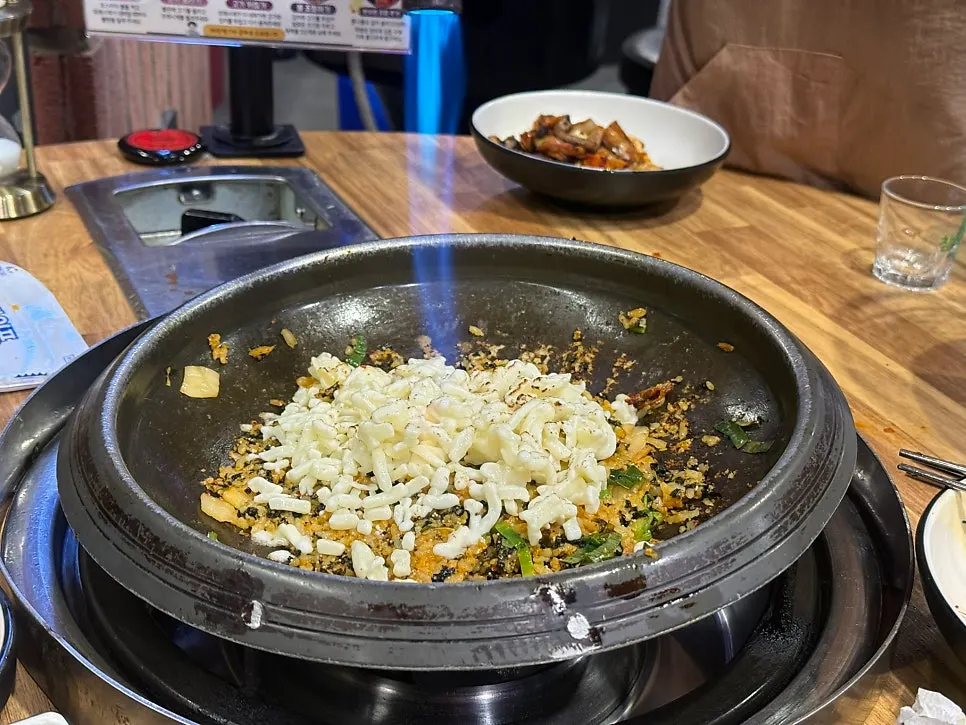 A mountain of cheese piled onto the fried rice