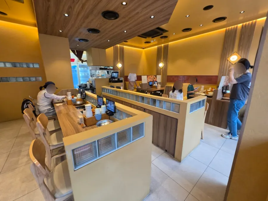 Interior of the restaurant busy with weekday dinner guests