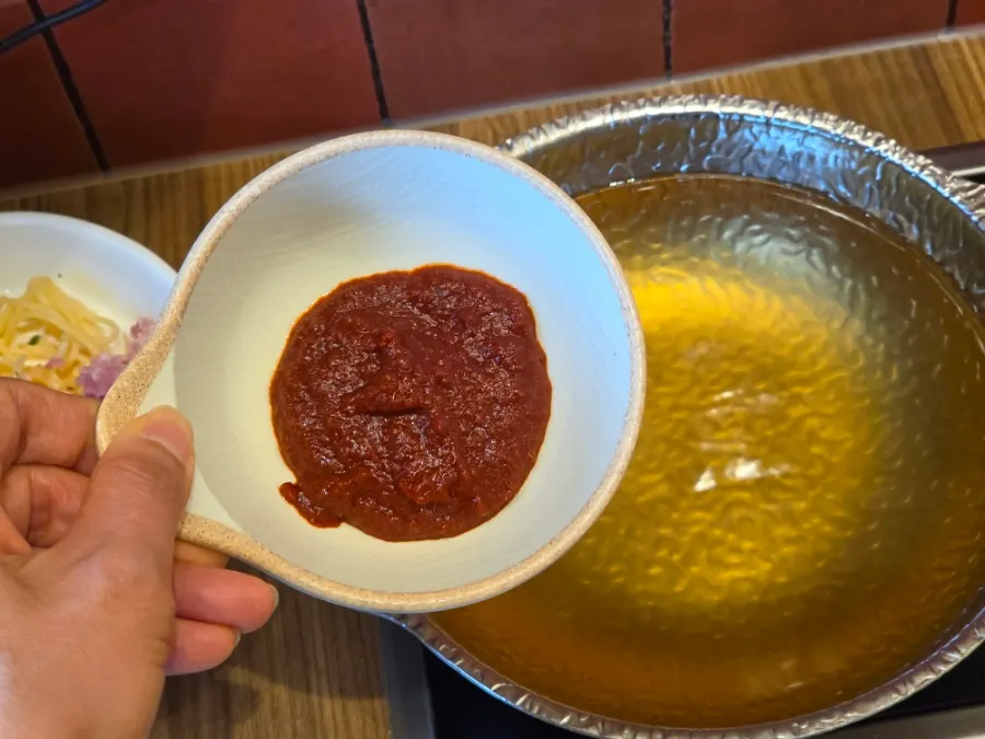 Spicy shabu-shabu broth with seasoning sauce stirred in