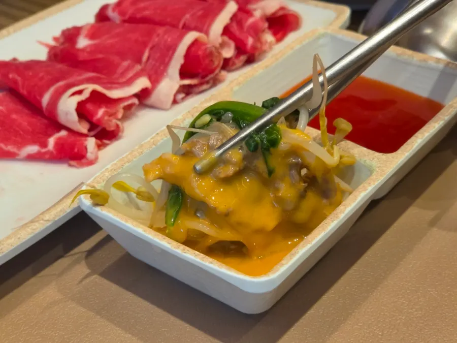 Shabu-shabu meat dipped in peanut sauce