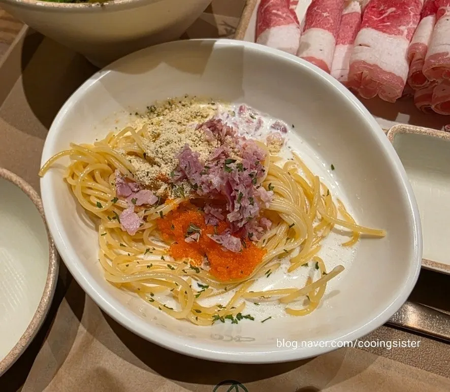 Pasta noodles with flying fish roe and bacon