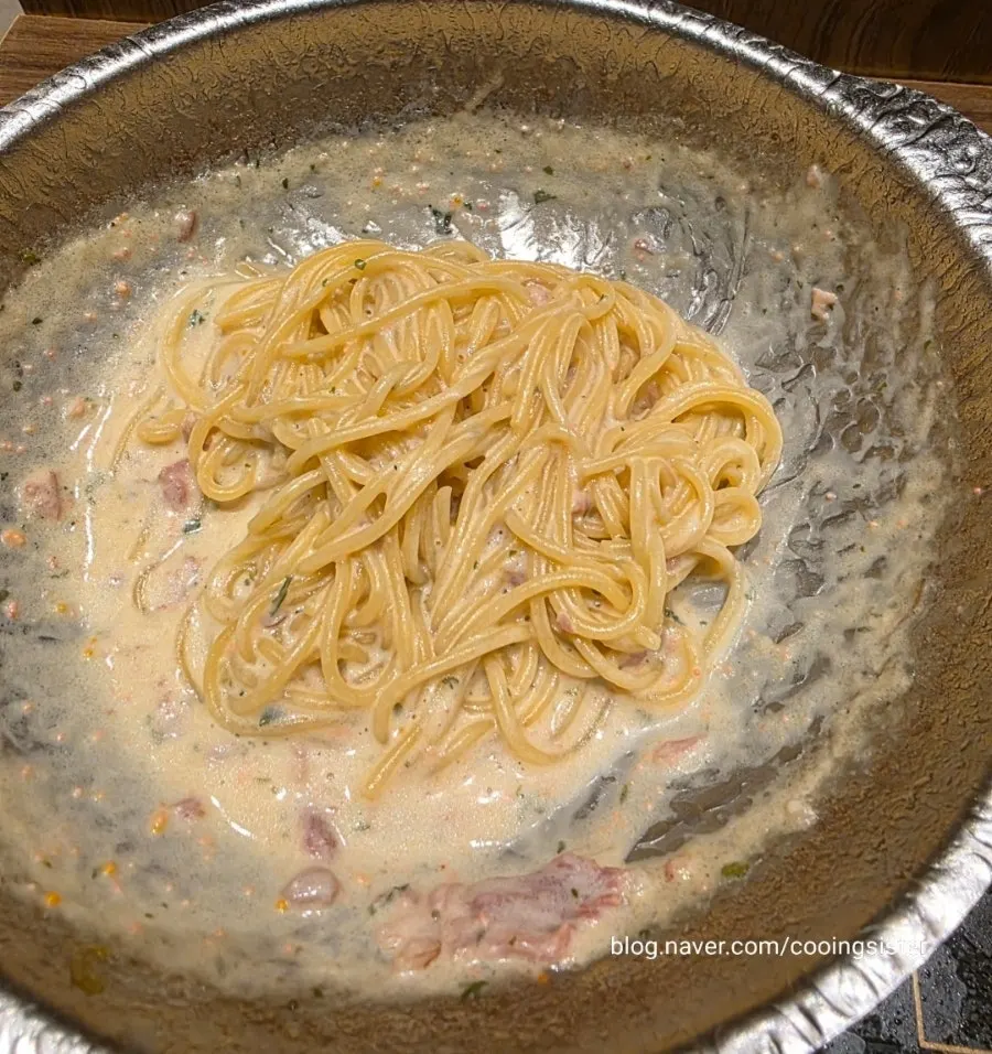 Thick cream pasta topped with grated cheese
