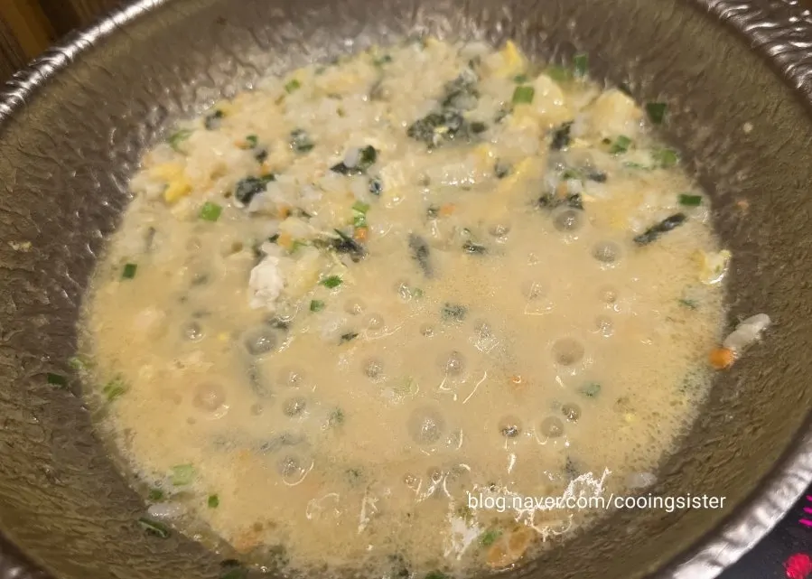 Egg porridge topped with dried seaweed flakes