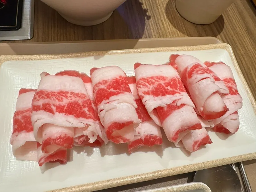 Spicy shabu-shabu broth served with vegetables and beef brisket