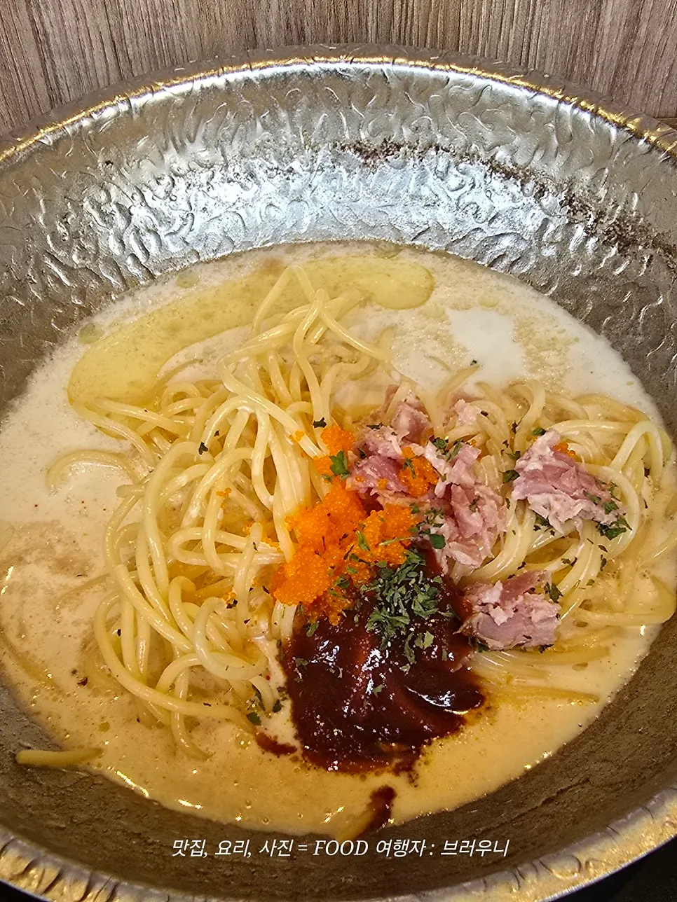 Cream mala pasta being simmered in leftover broth