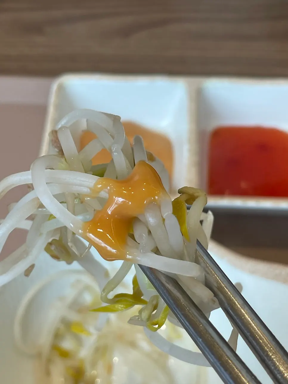 Individual shabu-shabu pot filled with bean sprouts and napa cabbage