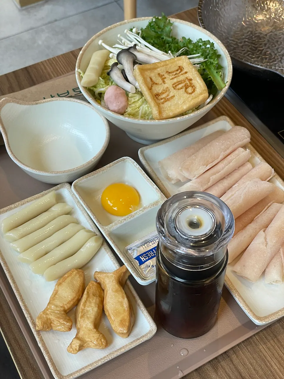 Sukiyaki pot with butter and sauce added