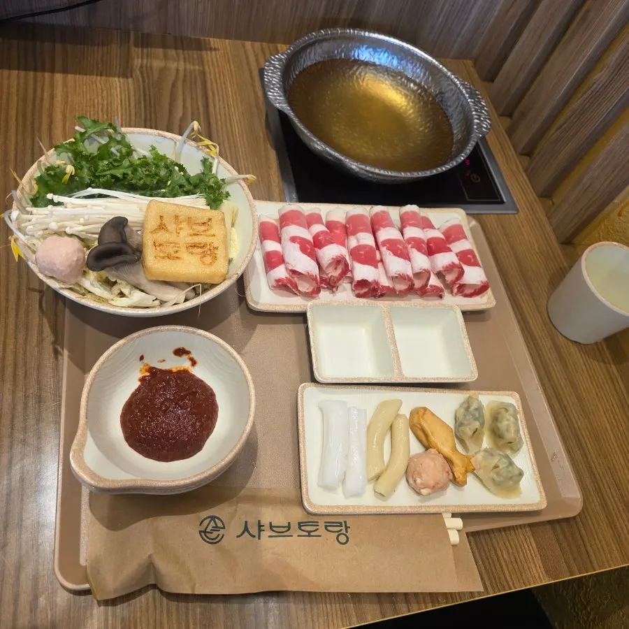 Spicy shabu served with basic broth plus a spicy sauce on the side