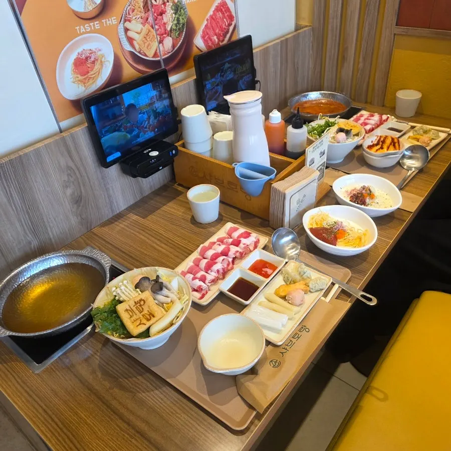 A full spread of shabu-shabu with two different broths for two people
