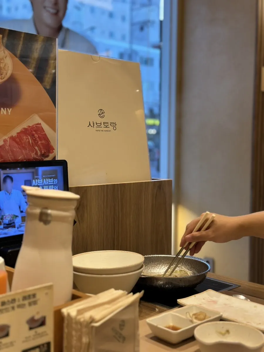 Interior with individual cooking setups at each table