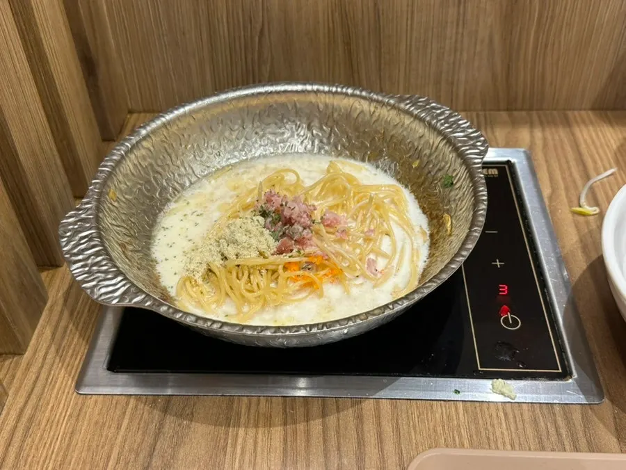 Cream pasta finished in the individual pot