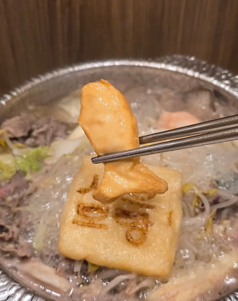 A plate of shabu-shabu cooked in the basic broth