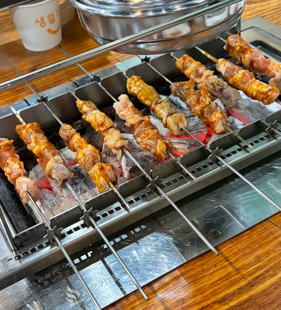 Plate of thick-cut signature lamb skewers