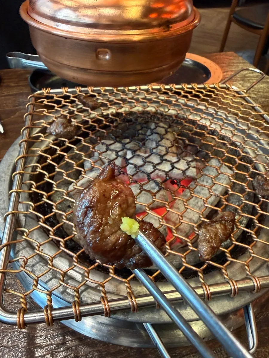 Well-cooked beef rib with dipping sauce