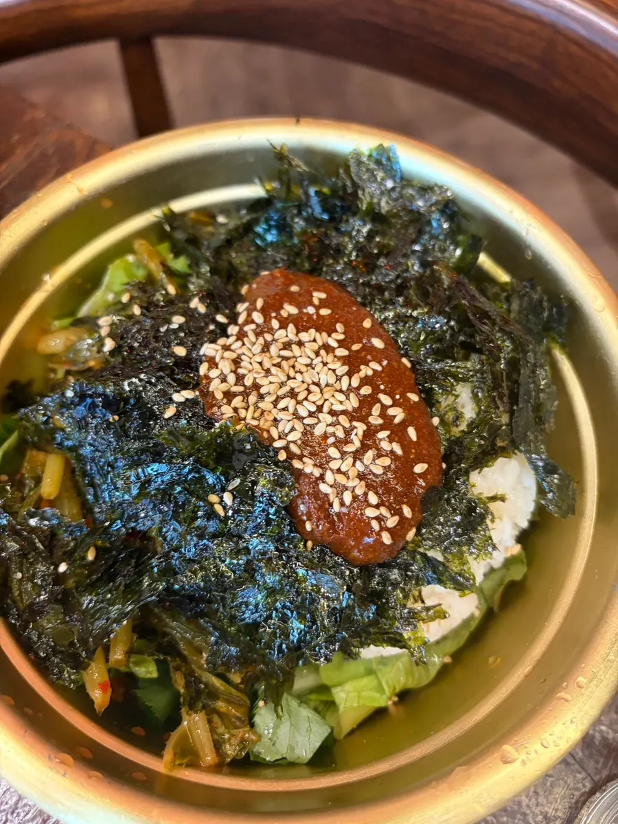 Diced flower-cut rib being turned on the charcoal