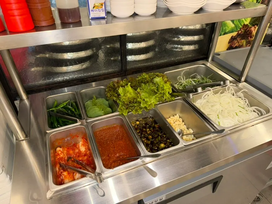 Self-serve station with lettuce and seasoned scallions