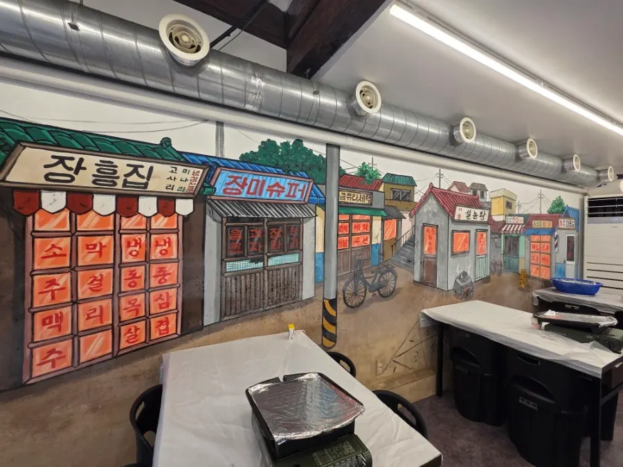 Interior of Jangheungjip with pojangmacha-style wall drawings