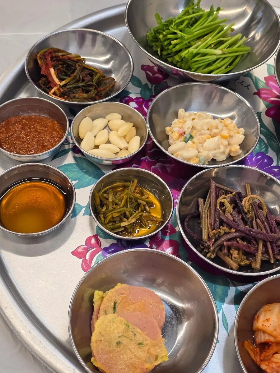 Corn salad and pink ham sausage side dishes
