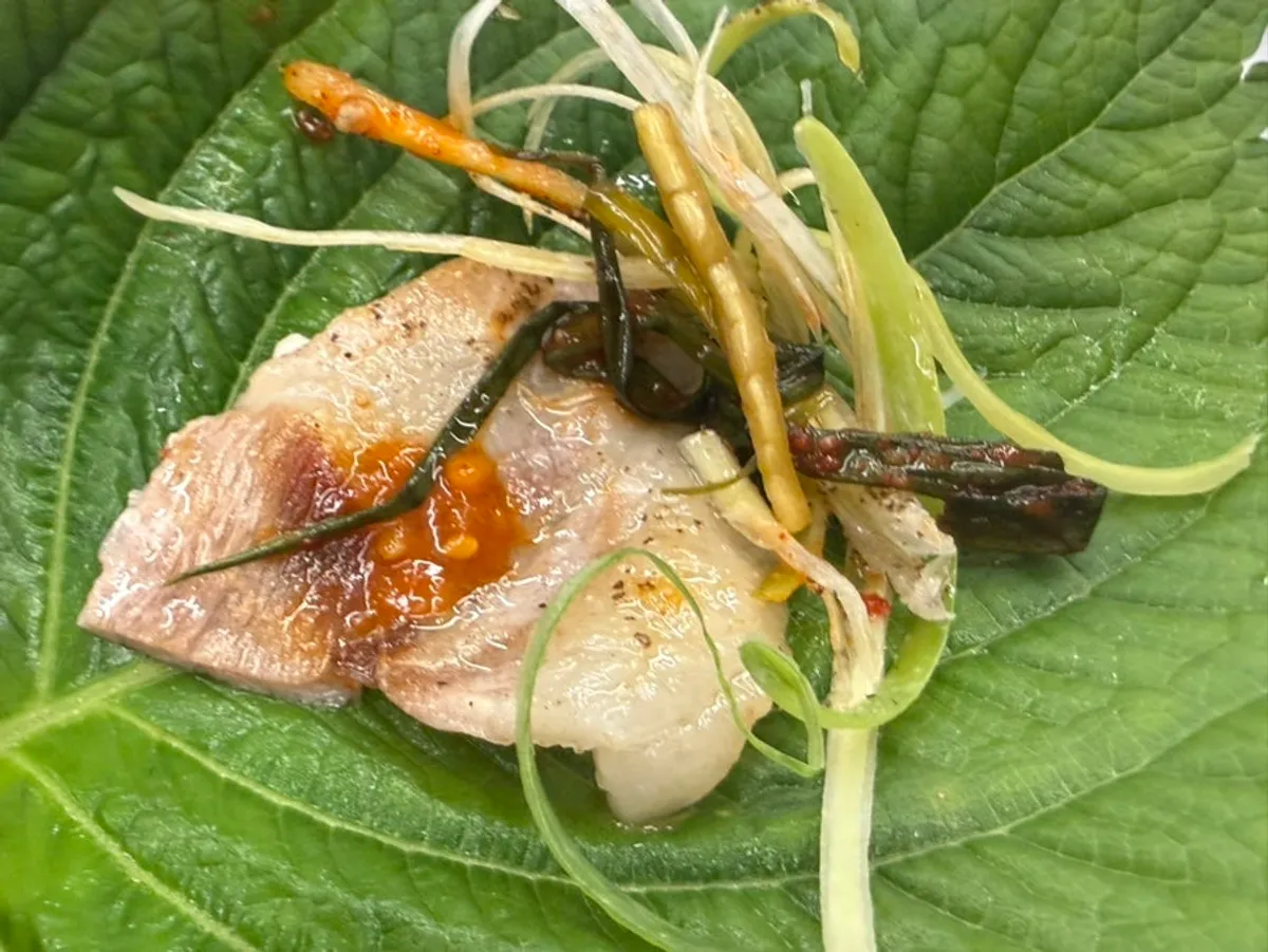 Perilla leaf wrap with pork belly, minari, and green onion kimchi