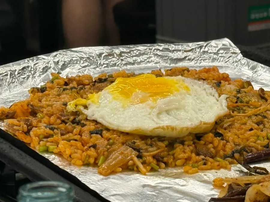 Finished fried rice topped with a fried egg