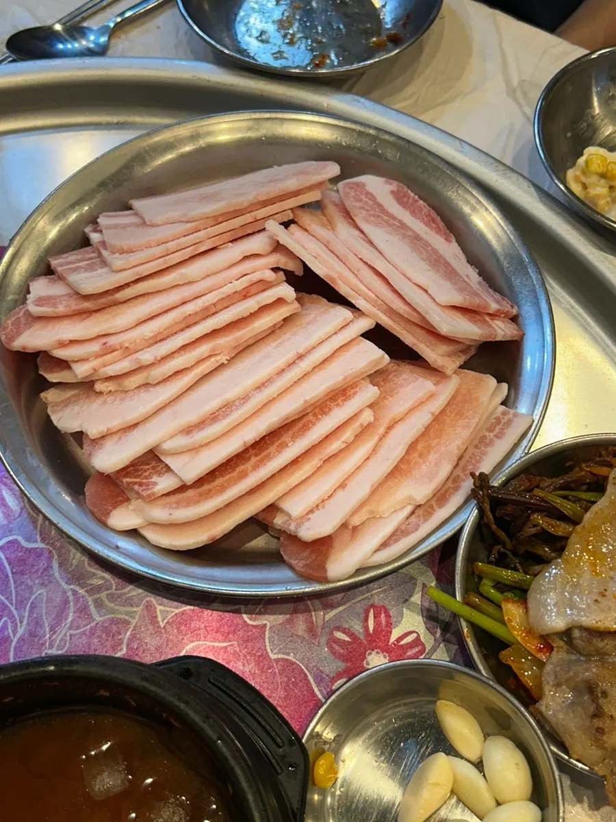 Frozen samgyeopsal served with Cheongdo minari