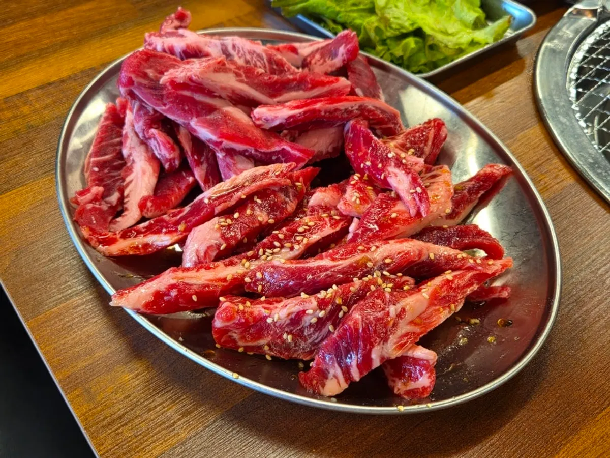 Plain beef ribs placed on the charcoal grill