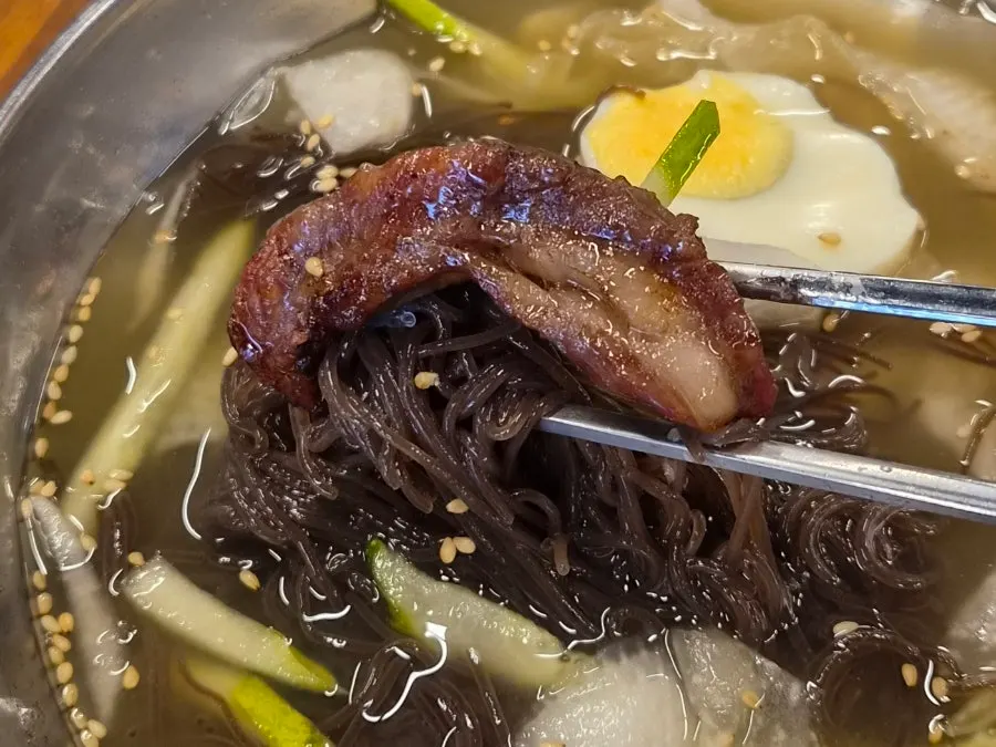 Marinated beef ribs eaten with rice