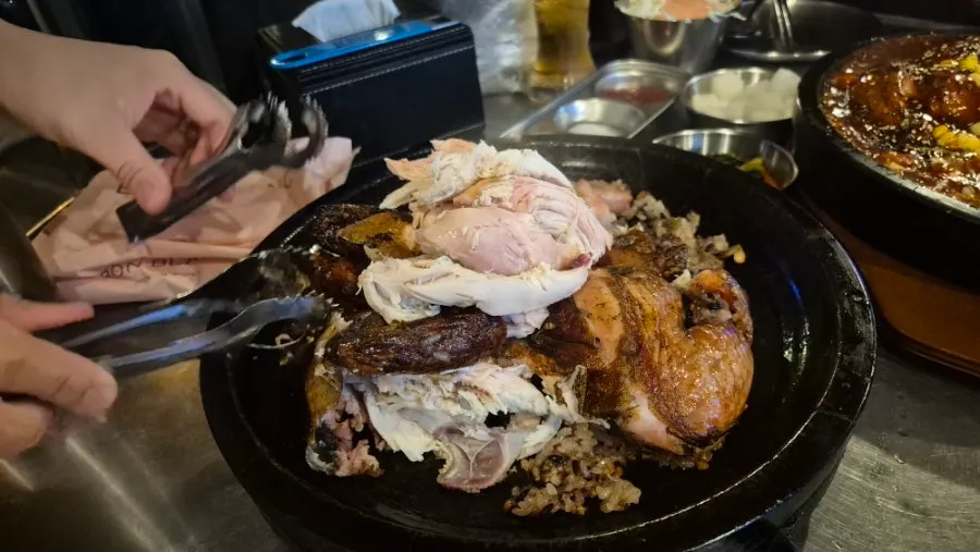 Herbal nurungji chicken and nurungji served on a stone plate
