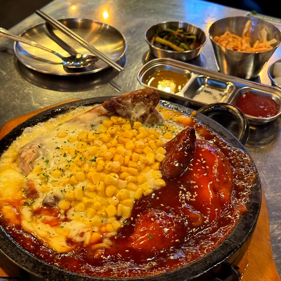 Close-up of sizzling seasoning and cheese