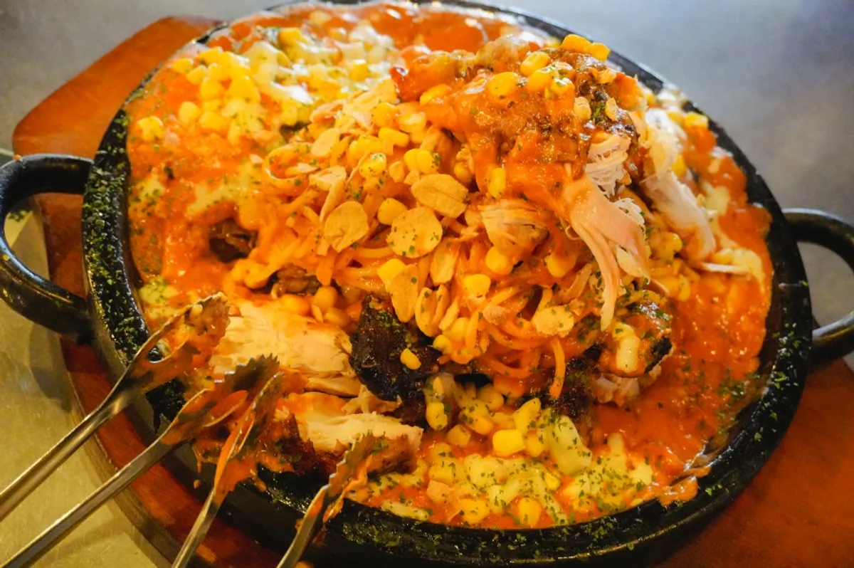 Rosé nurungji tongdak with breast meat placed on top